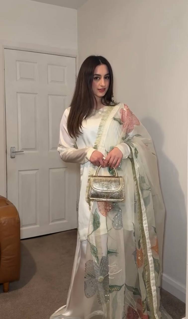 "Grace in Gold & Ivory: Floral Elegance in Traditional Attire"