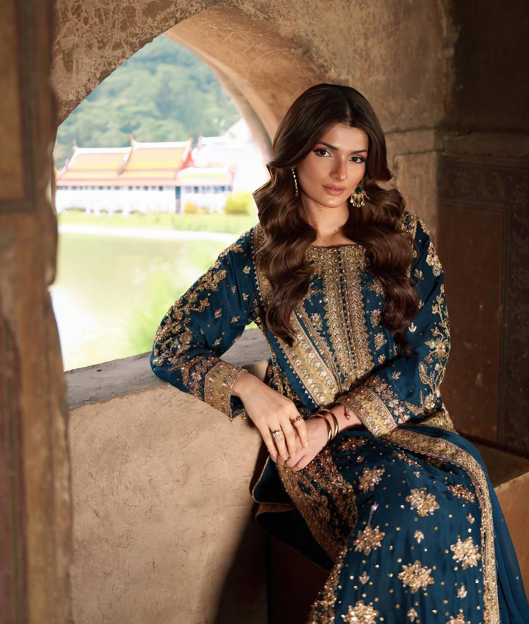 Elegant Woman in Traditional Blue and Gold Embroidered Dress
