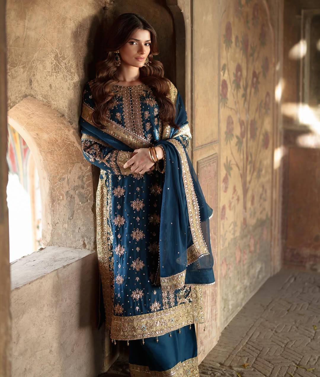 Elegant Woman in Traditional Blue and Gold Embroidered Dress
