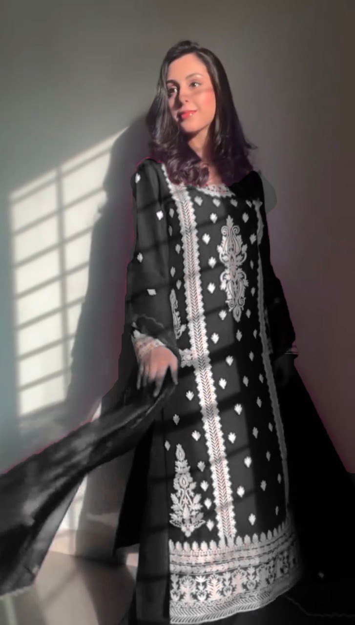 Elegant traditional outfit in vibrant red and timeless black contrast