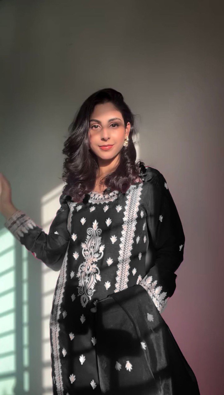 Elegant traditional outfit in vibrant red and timeless black contrast
