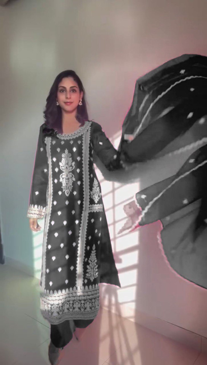 Elegant traditional outfit in vibrant red and timeless black contrast