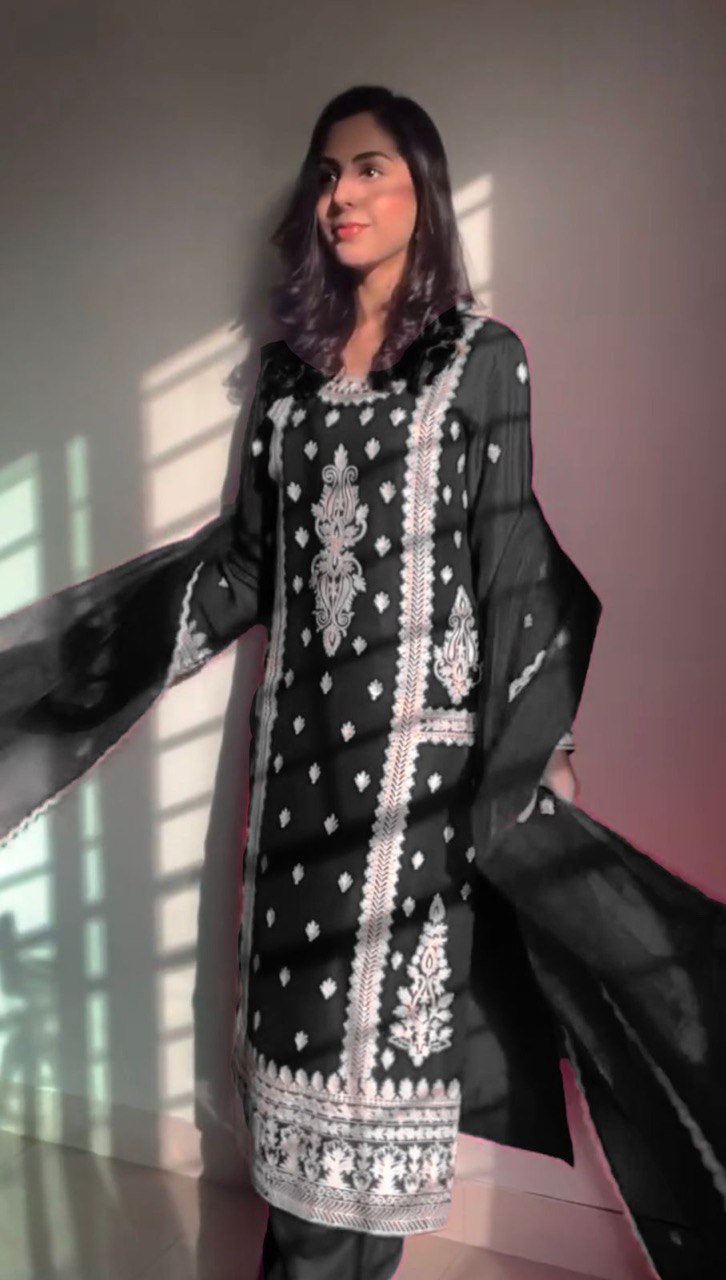 Elegant traditional outfit in vibrant red and timeless black contrast
