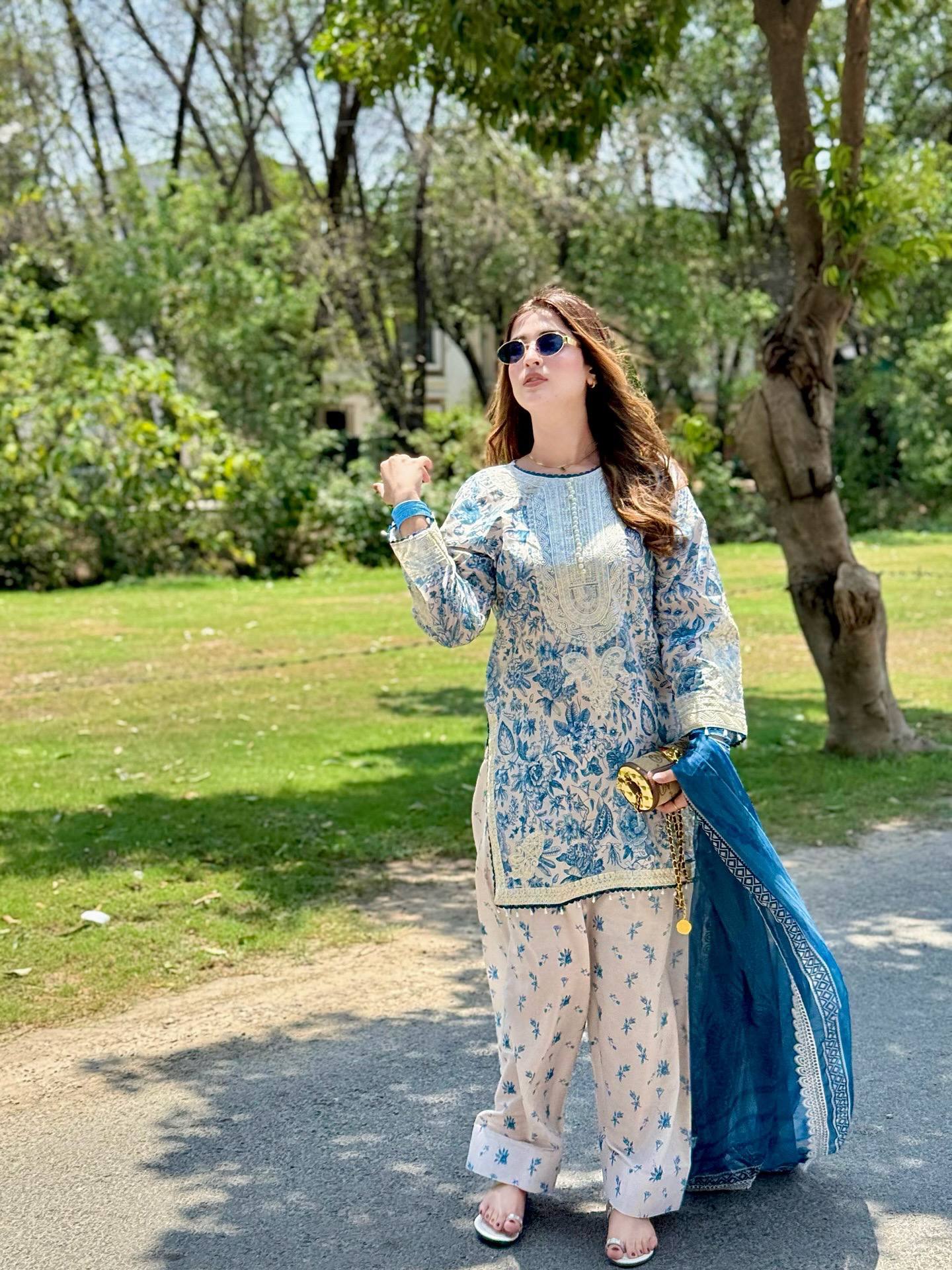 Elegance in Motion: A Woman's Journey in Blue and Whit