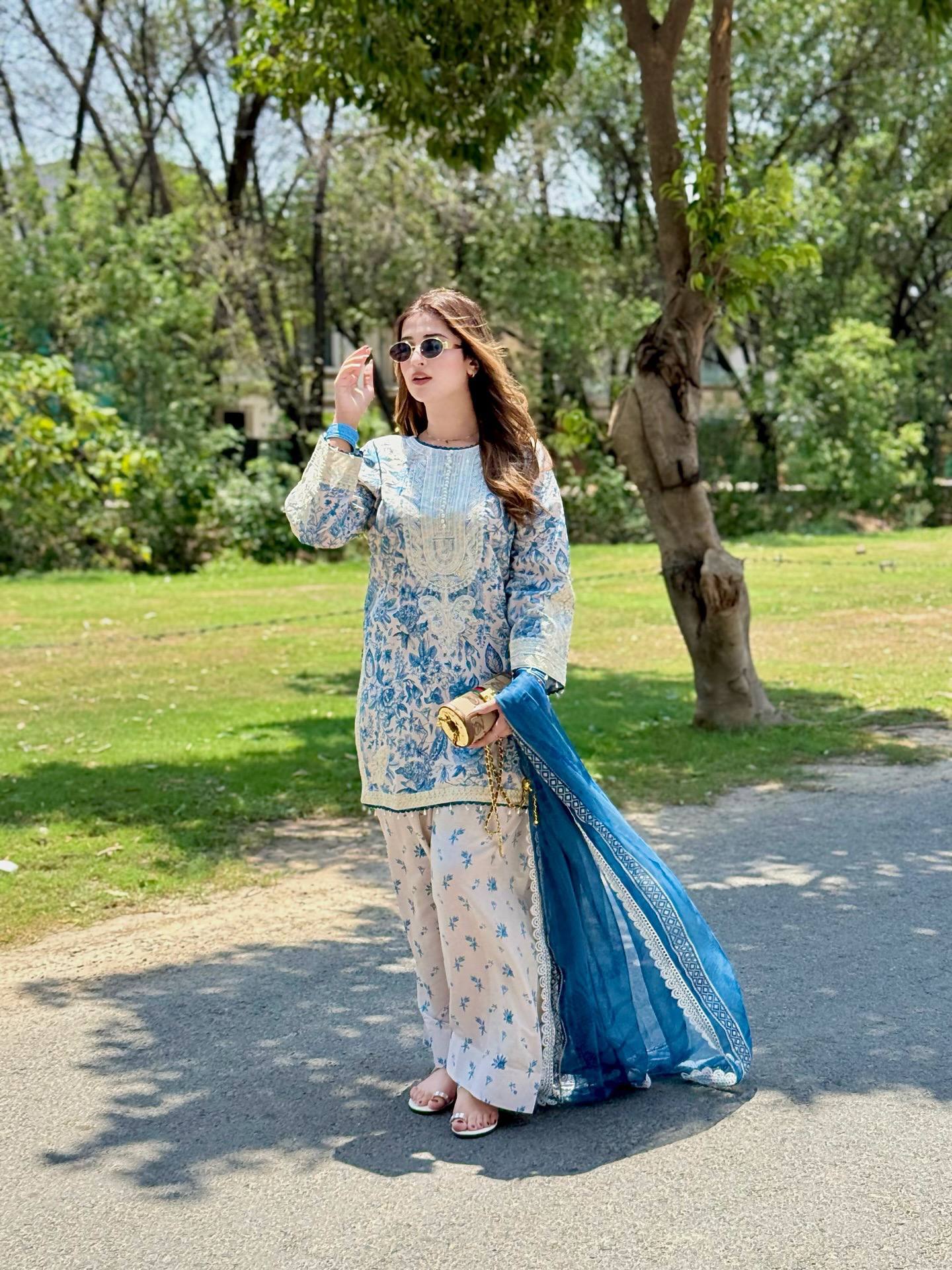 Elegance in Motion: A Woman's Journey in Blue and Whit