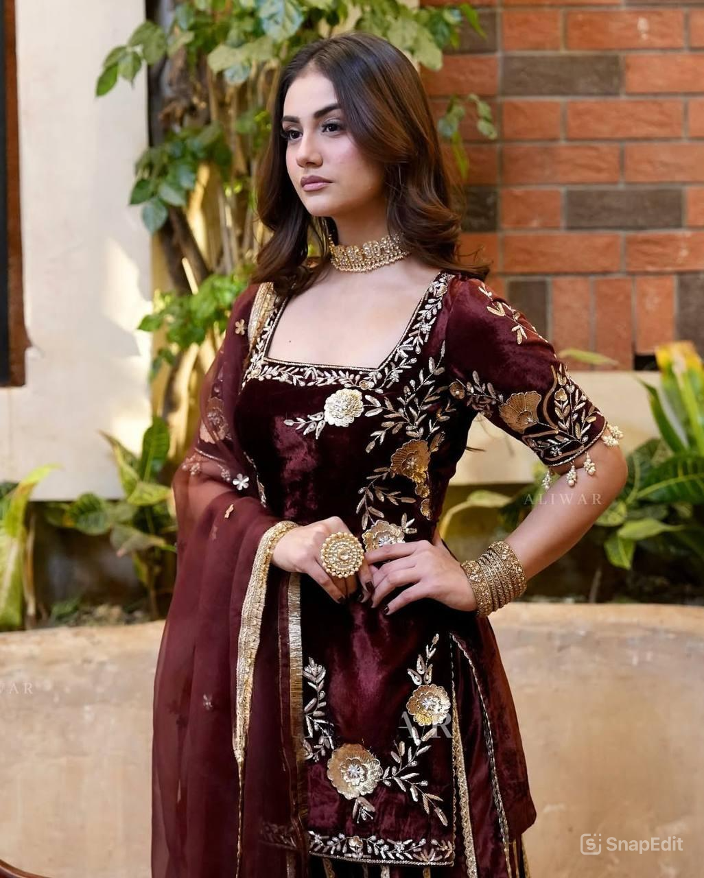 Graceful Maroon Sharara Adorned with Golden Floral Patterns