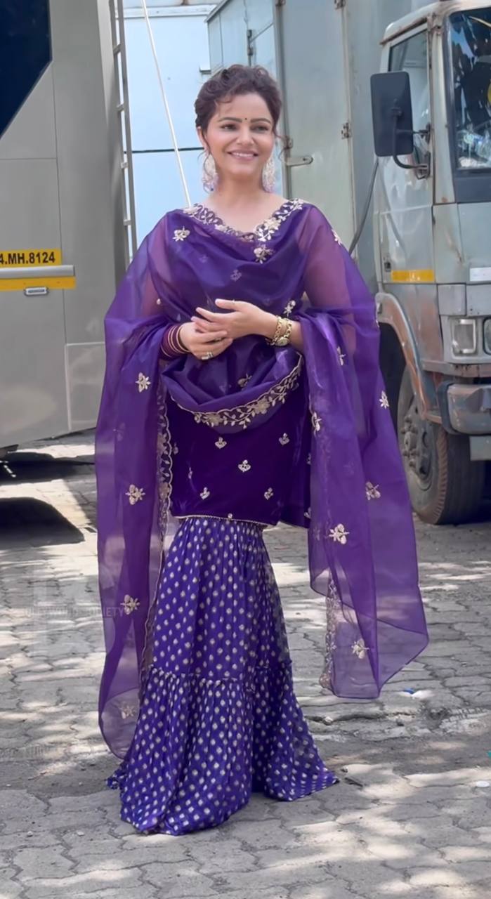 Regal Elegance: Purple Sari with Golden Embroidery