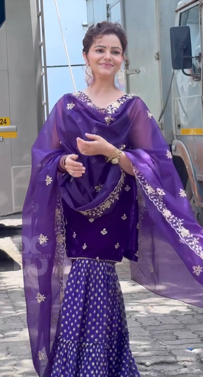 Regal Elegance: Purple Sari with Golden Embroidery