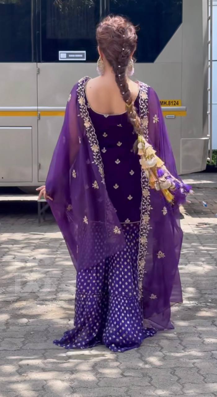 Regal Elegance: Purple Sari with Golden Embroidery