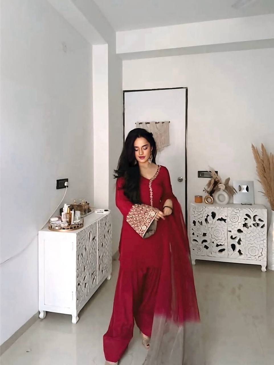 Elegant Brown Traditional Outfit with Orange Dupatta, Embellished Sleeves, and Gold Jewelry Ensemble