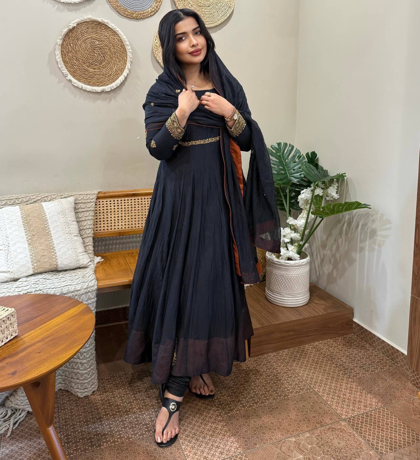 Elegance Unveiled A Woman in Timeless Black Attire