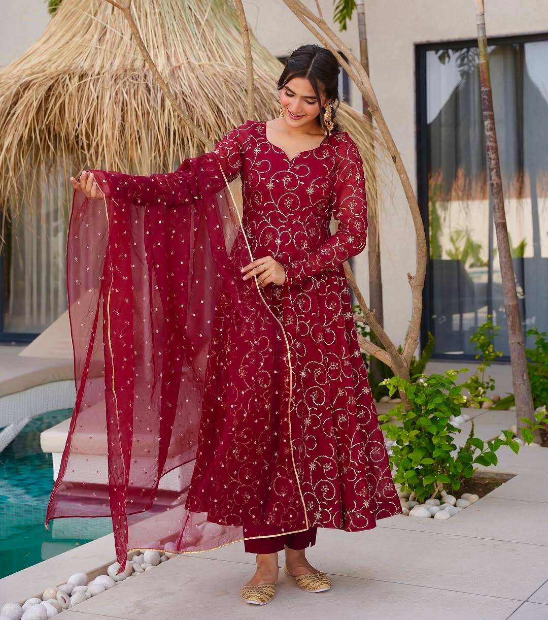 Luxe Serenity: Woman in Maroon by Water