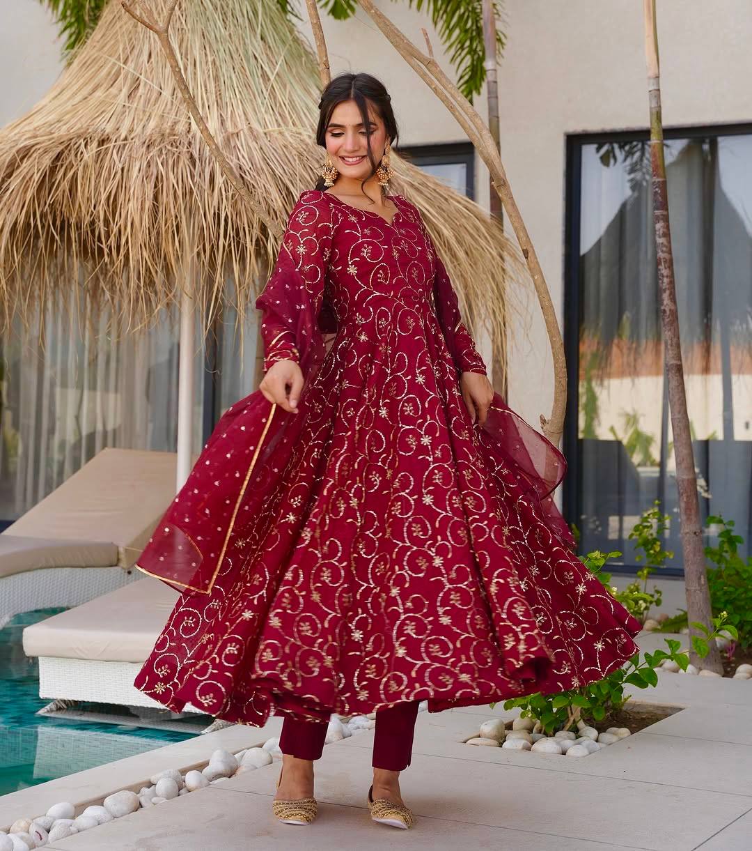 Luxe Serenity: Woman in Maroon by Water
