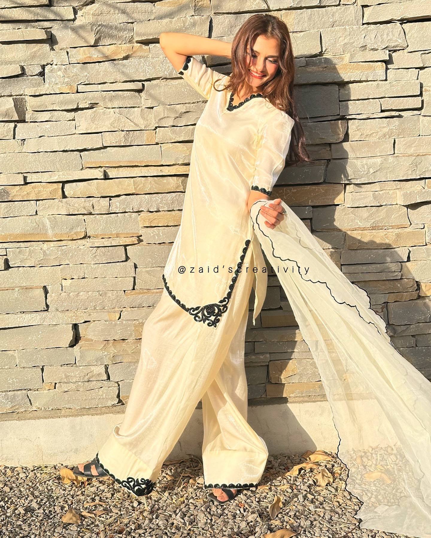 The Essence of Sophistication: A Woman in a Striking White Suit Portrait