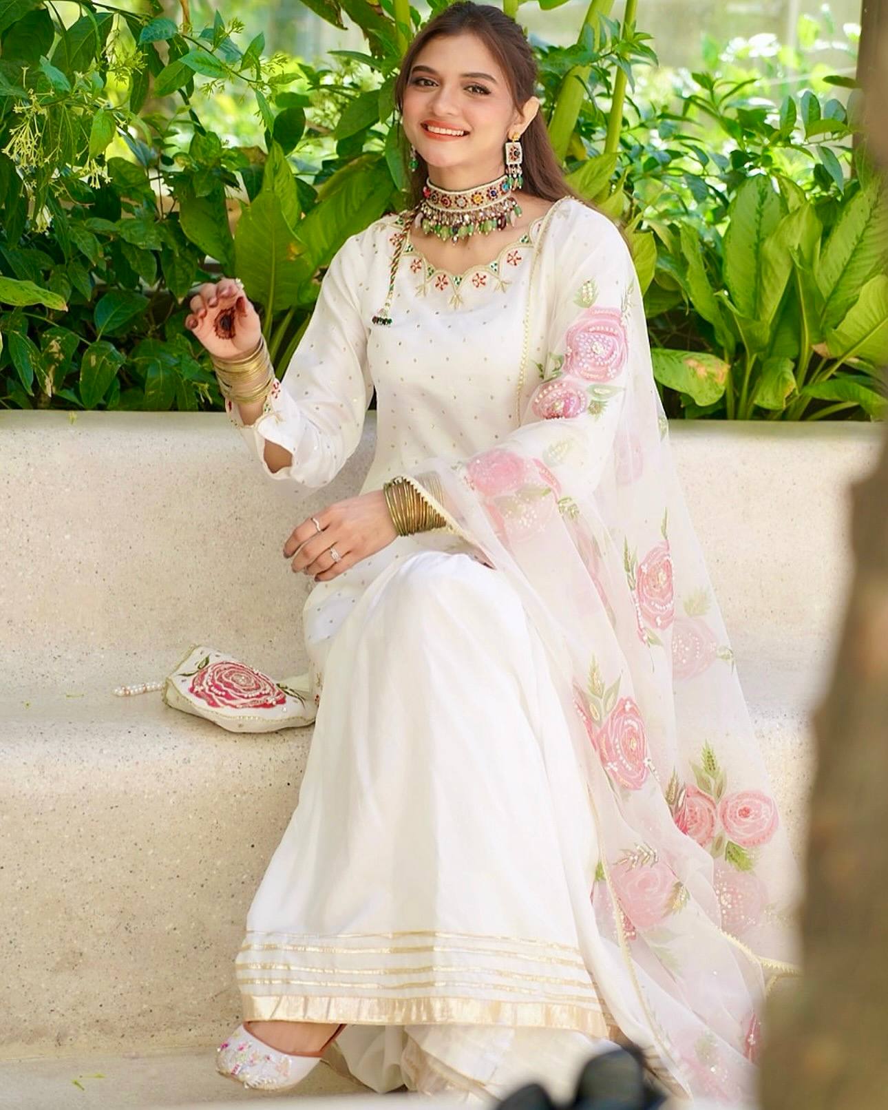 Elegant Blossom: White Embroidered Suit Adorned with Pink Petals