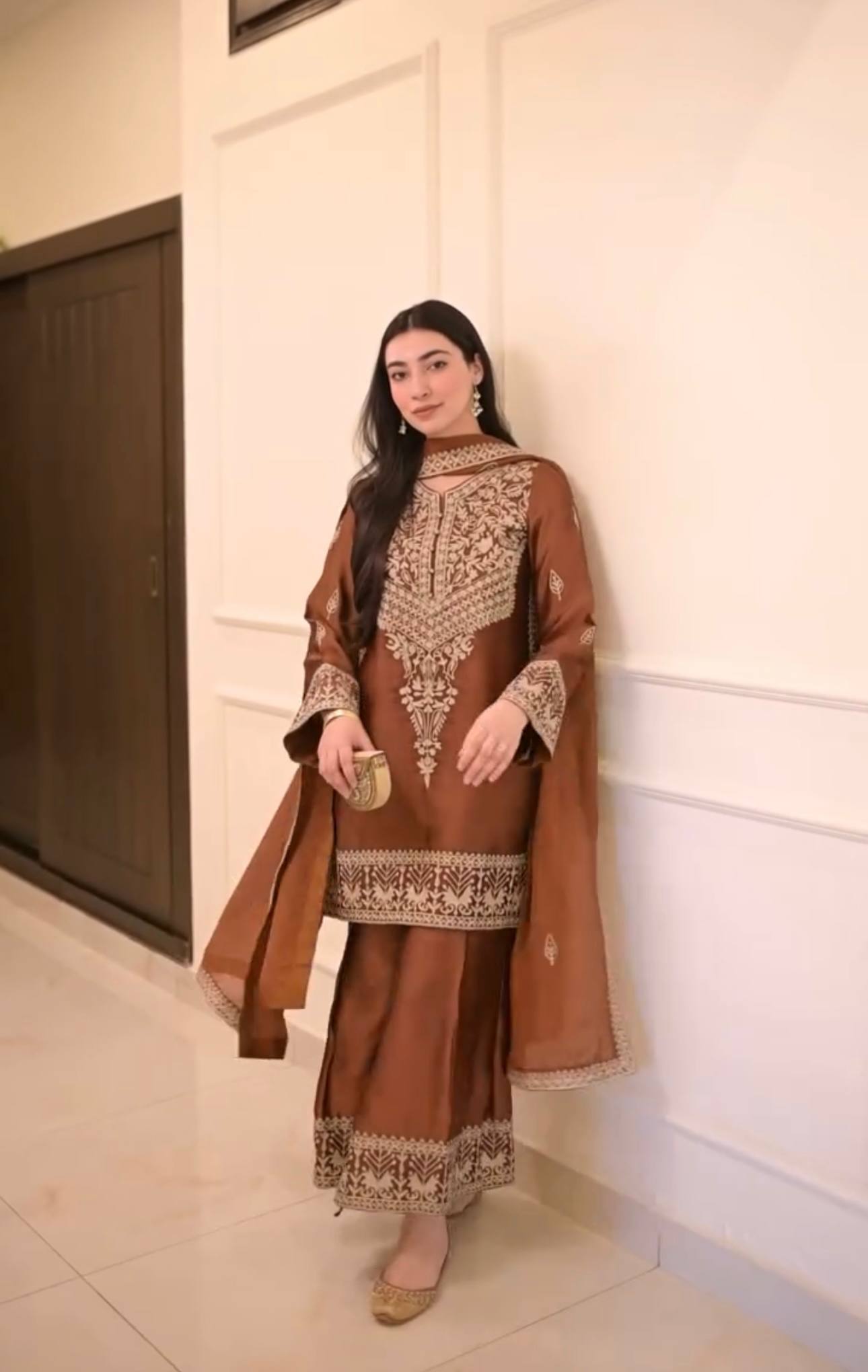 legance in Earth Tones: A Serene Moment on the Steps